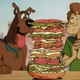 If cartoons have taught us anything, it’s that dogs love sandwiches bigger than their heads.